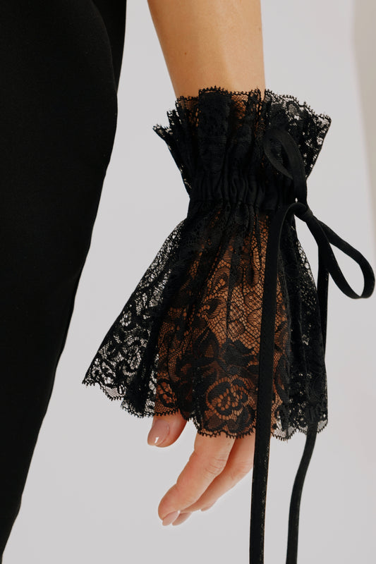 Black lace cuffs with decorative ribbon