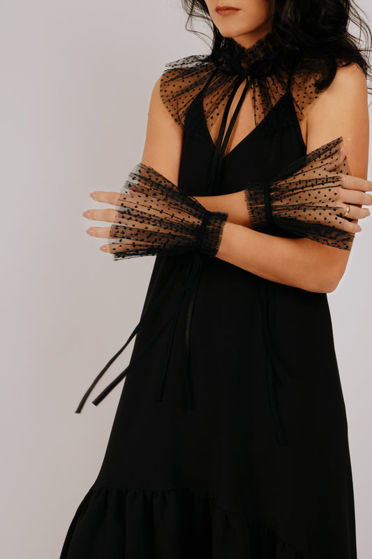 Black pompom tulle cuffs with a decorative ribbon